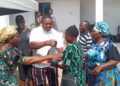 Chief Kingsley Udoka distributes food items to widows in Ekwuoma